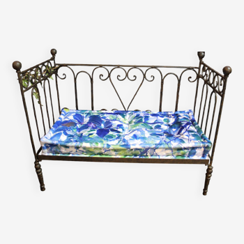 Wrought iron bed and blue wool mattress