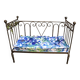Wrought iron bed and bluish wool mattress