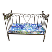 Wrought iron bed and bluish wool mattress