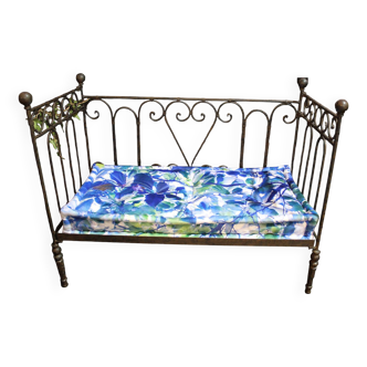 Wrought iron bed and blue wool mattress