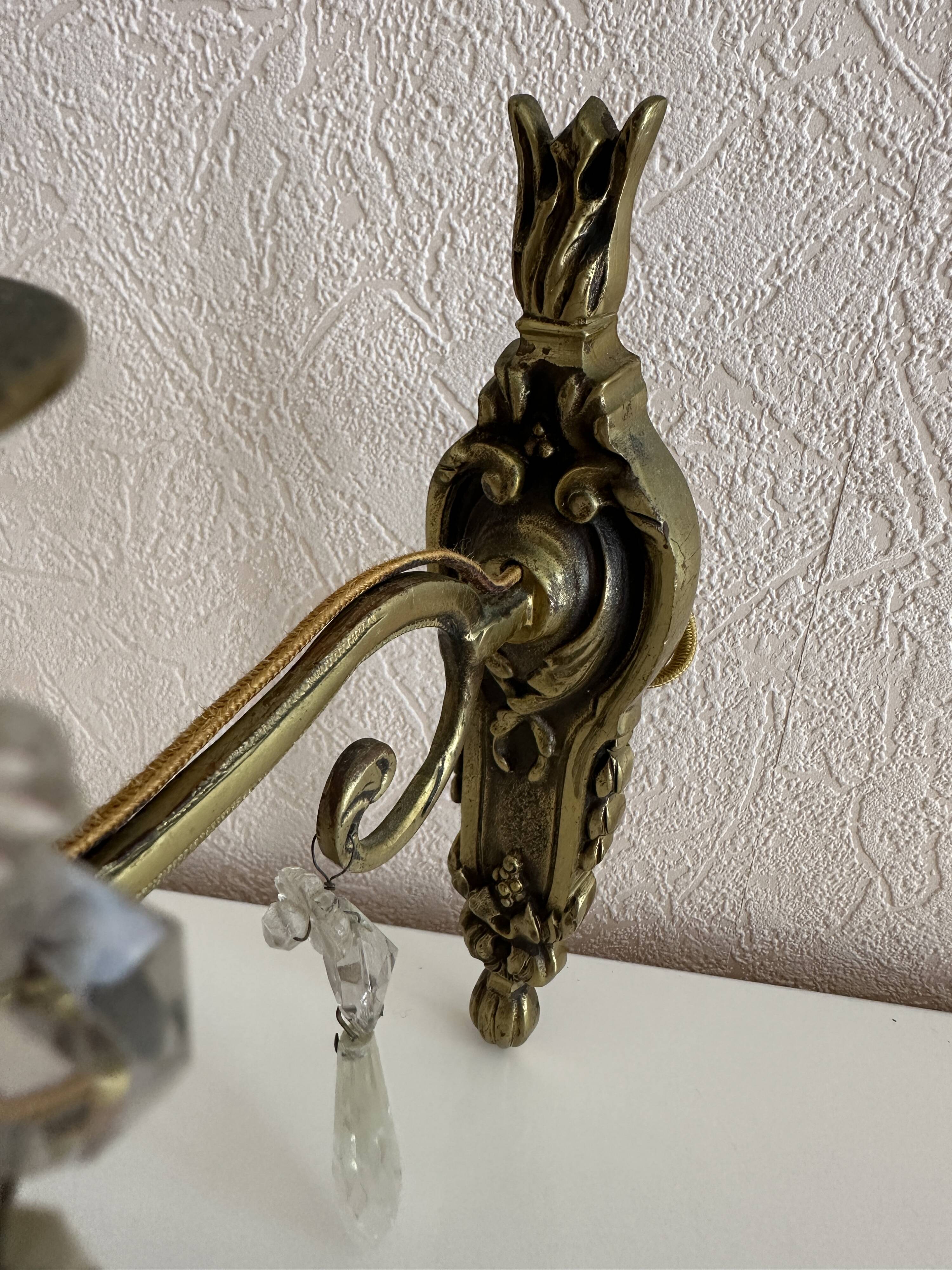 Pair of bronze wall lights with crystal pendants – Louis XV style