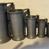 7 tin measuring pots