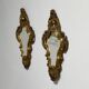 Pair of mirrors in wood decorated with gold leaf.