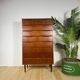 Mid-century Danish high chest of drawers with eight teak drawers.