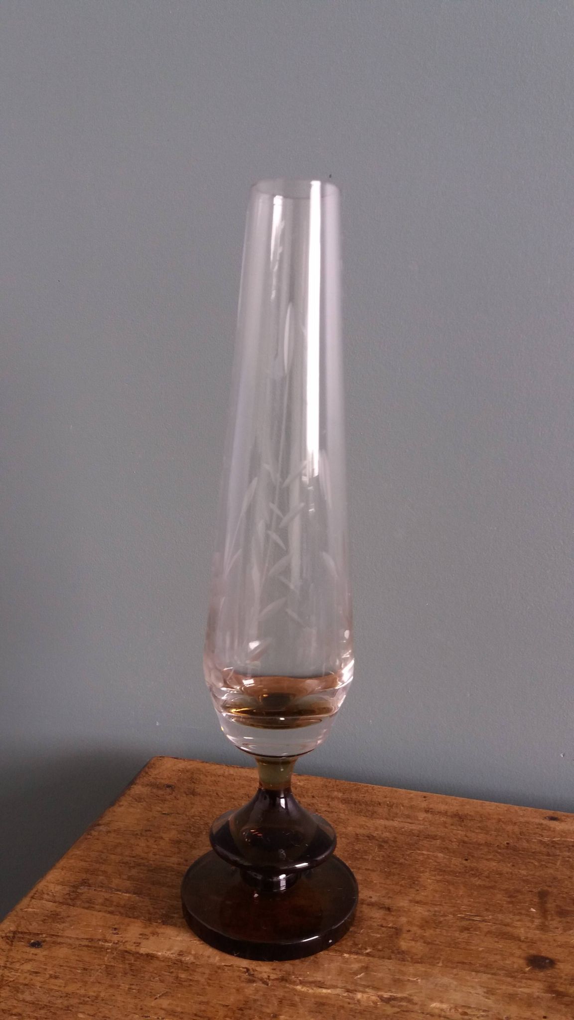 Cut glass soliflore vase with a smoked glass base.