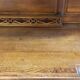 Art Nouveau buffet in carved oak with grapevine cluster decoration.