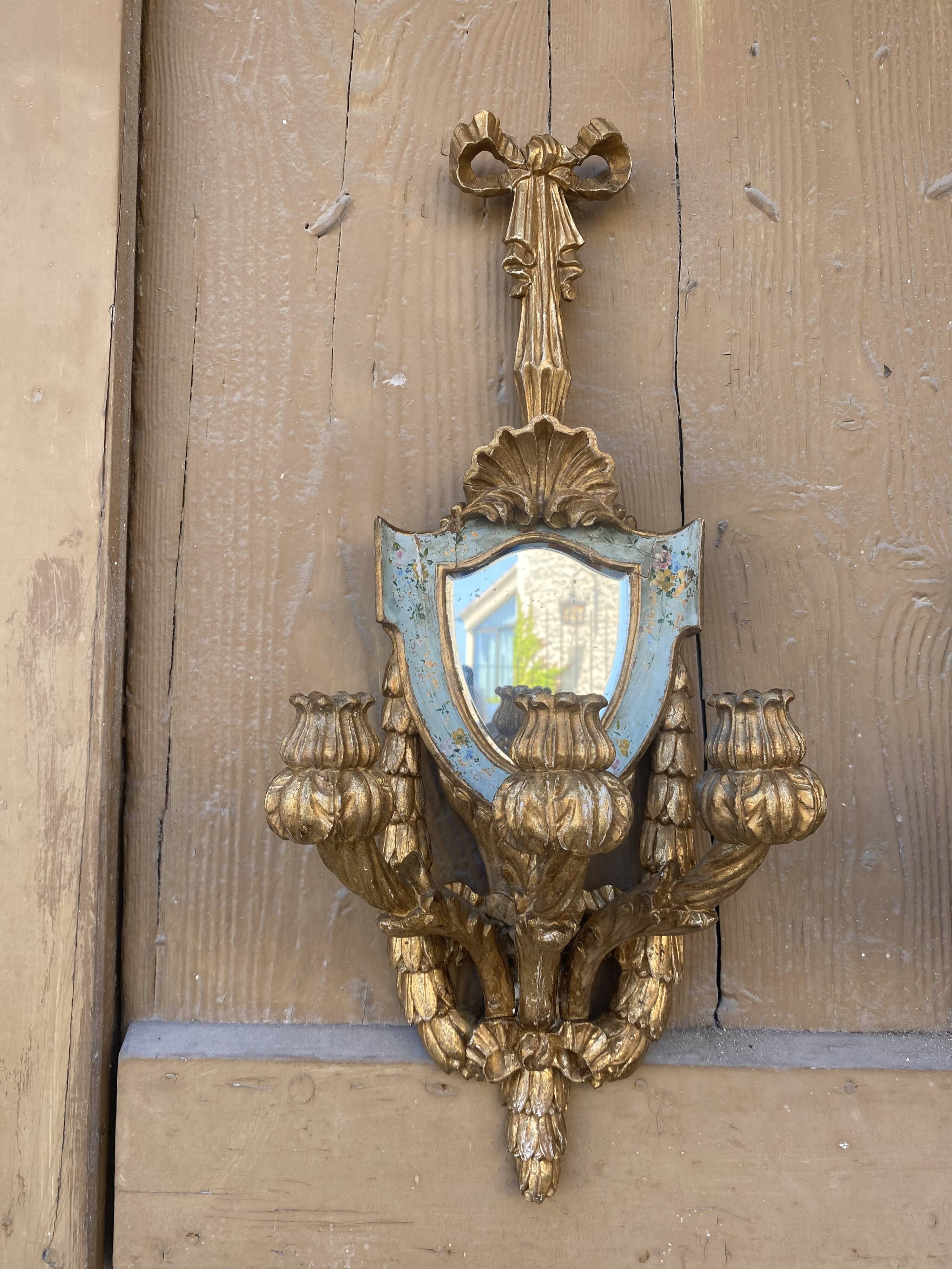 Pair of carved wood sconces