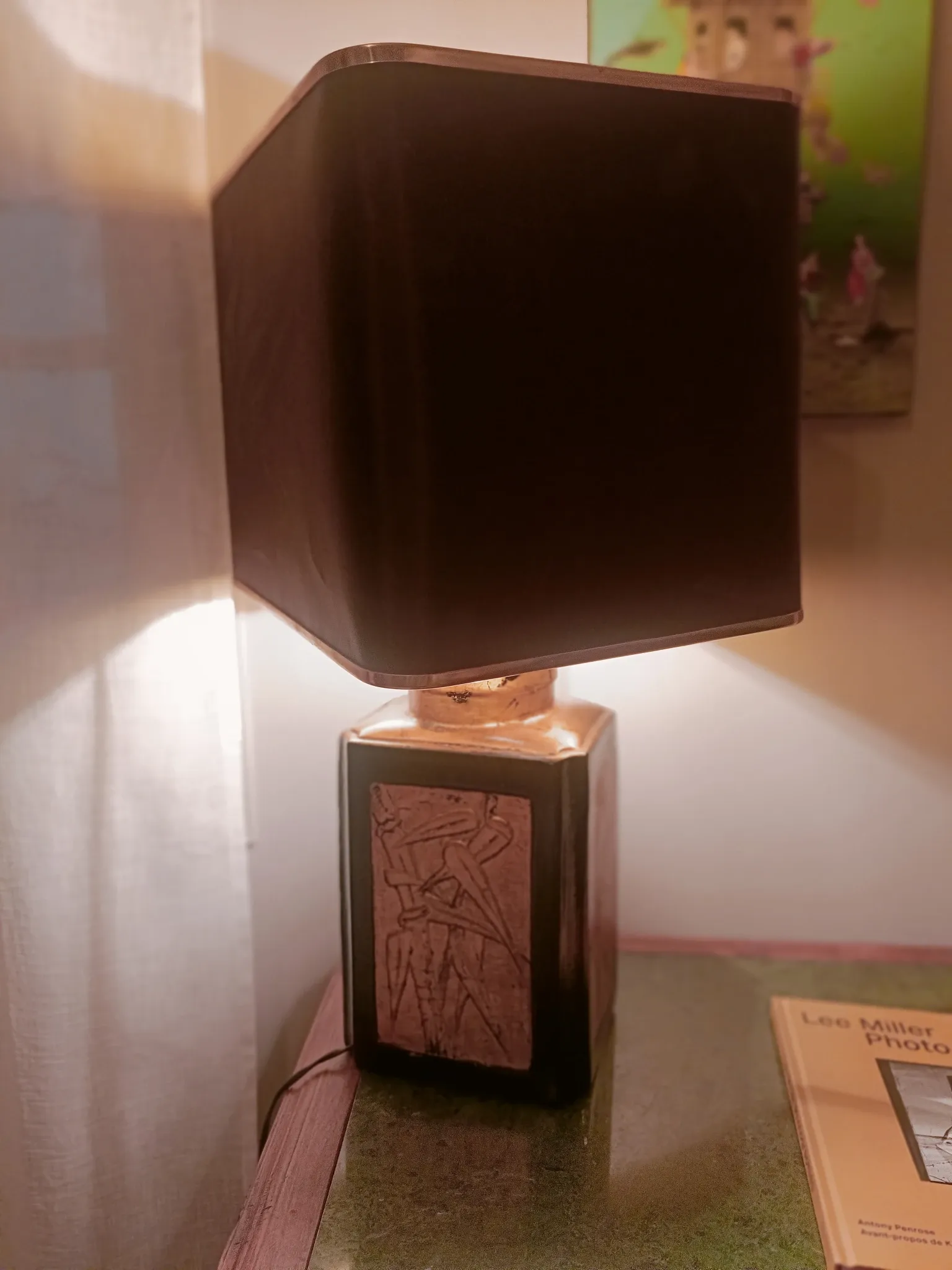 Large ceramic lamp with an Asian theme.