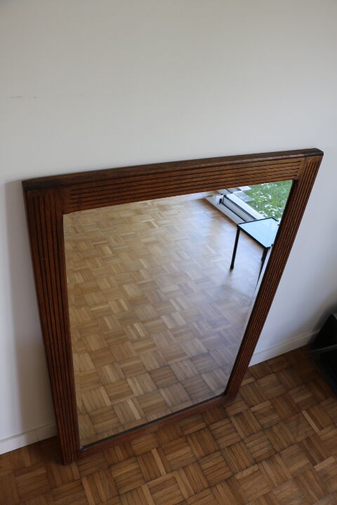 Beveled mirror grooved wood