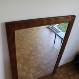Beveled mirror grooved wood