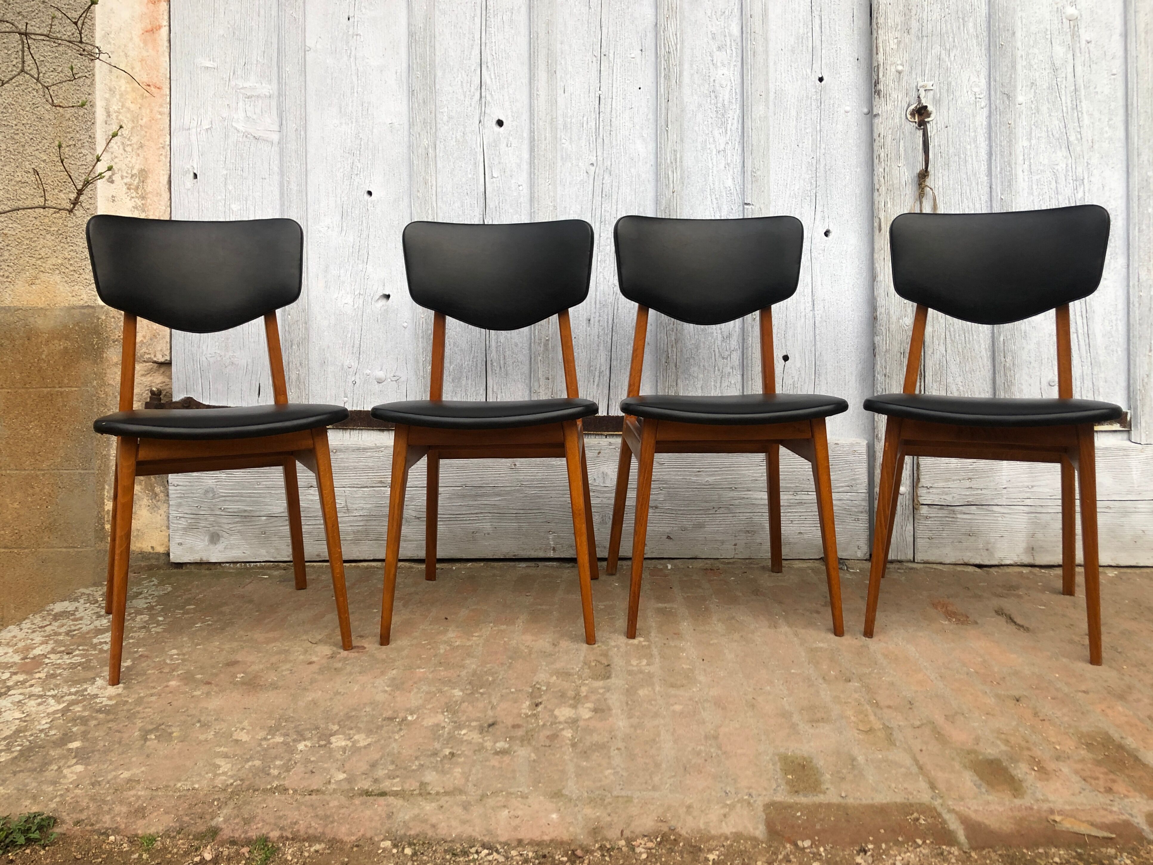 Set of 4 Scandinavian teak and black skai chairs