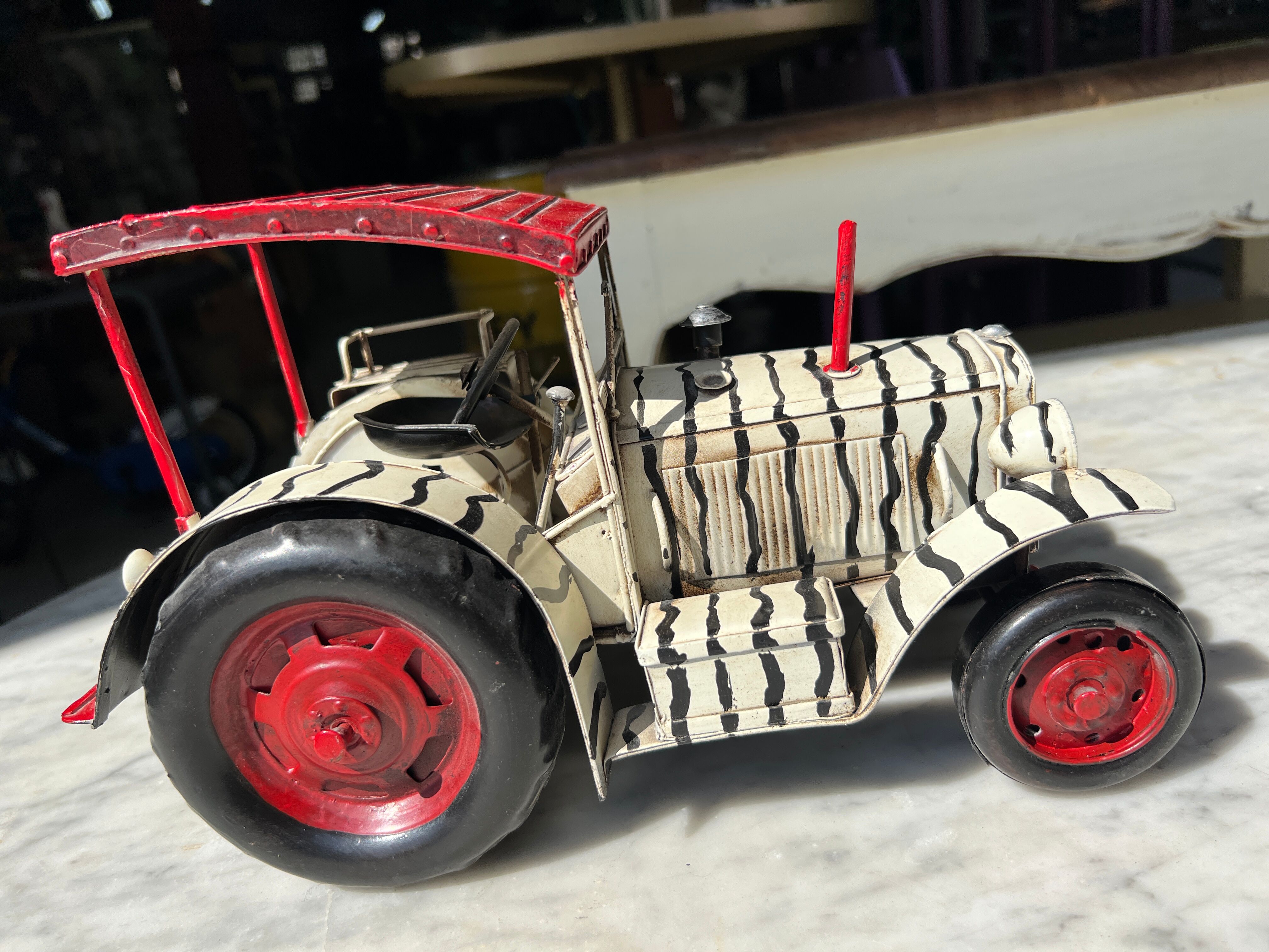 Old zebra metal tractor