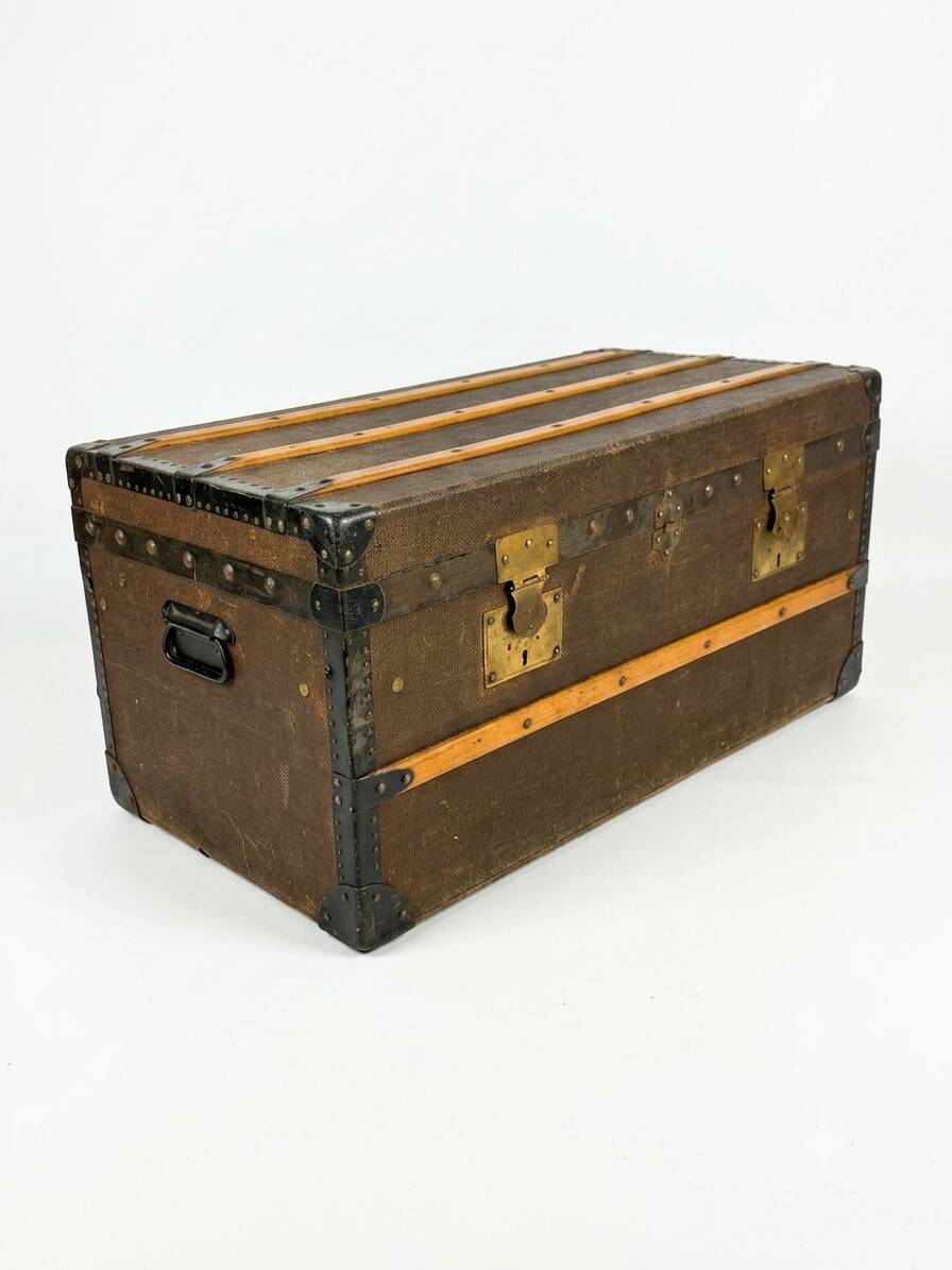 Old travel trunk in oilcloth