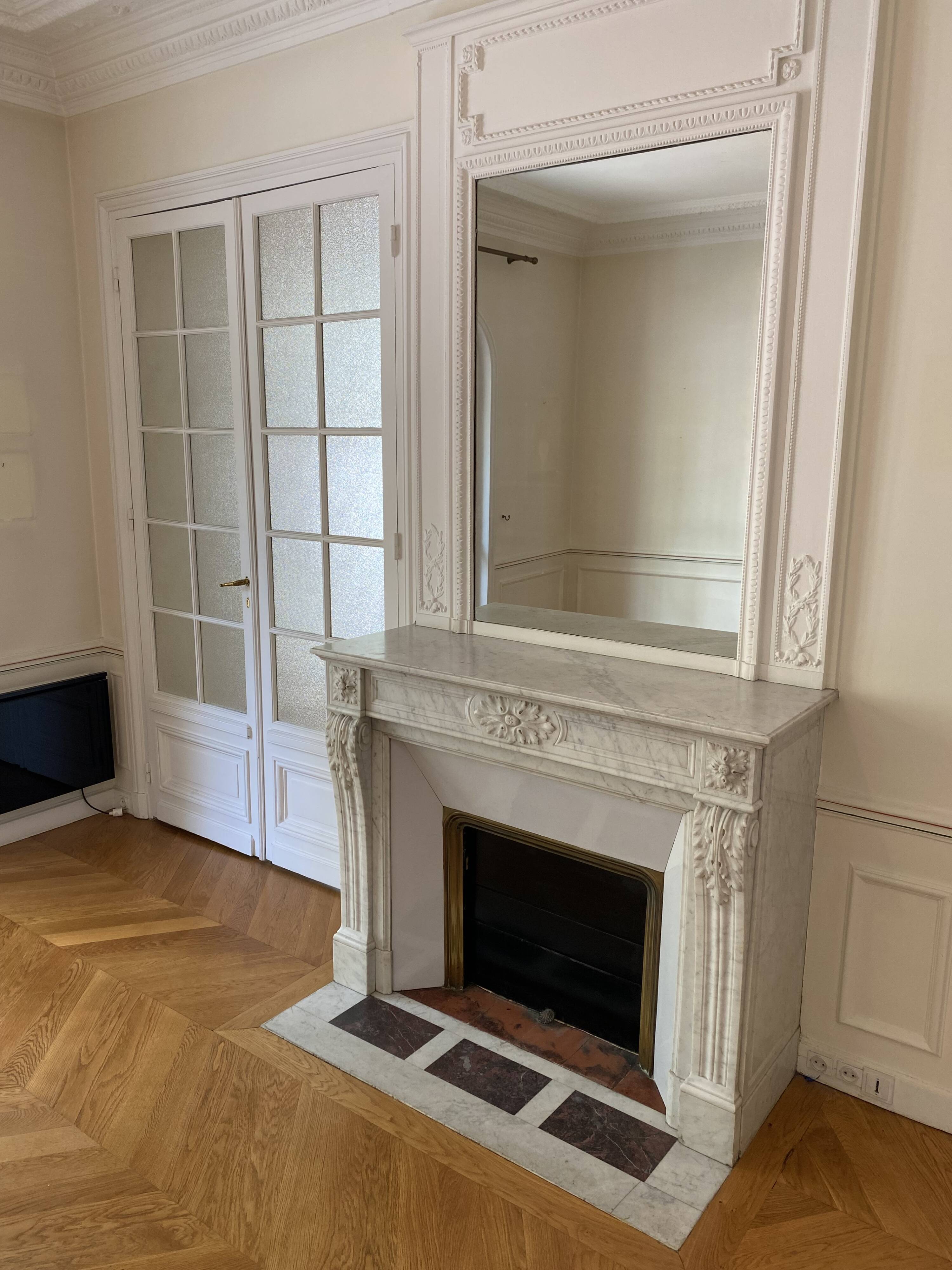 Antique marble fireplace with overmantel and mirror - Haussmannian apartment