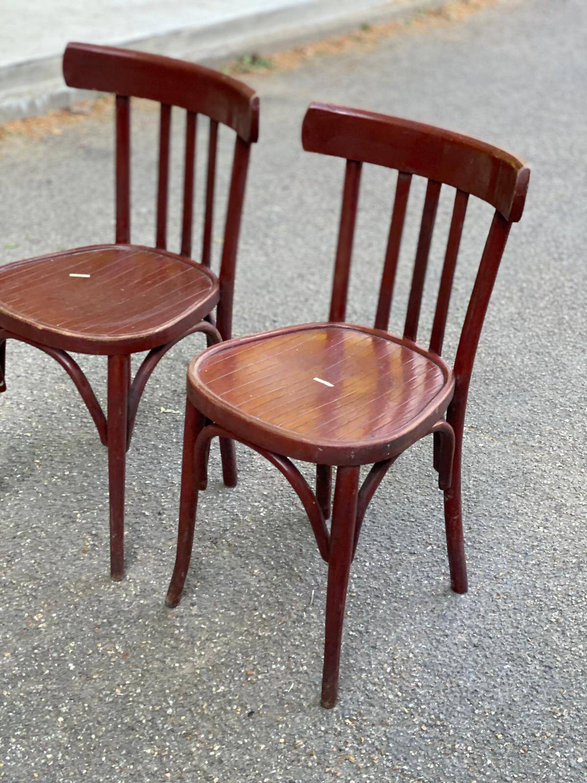2 burgundy curved wooden bistro chairs from Ets Joseph Levallois