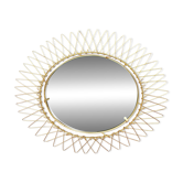 Vintage 1950s sun mirror in gold metal.