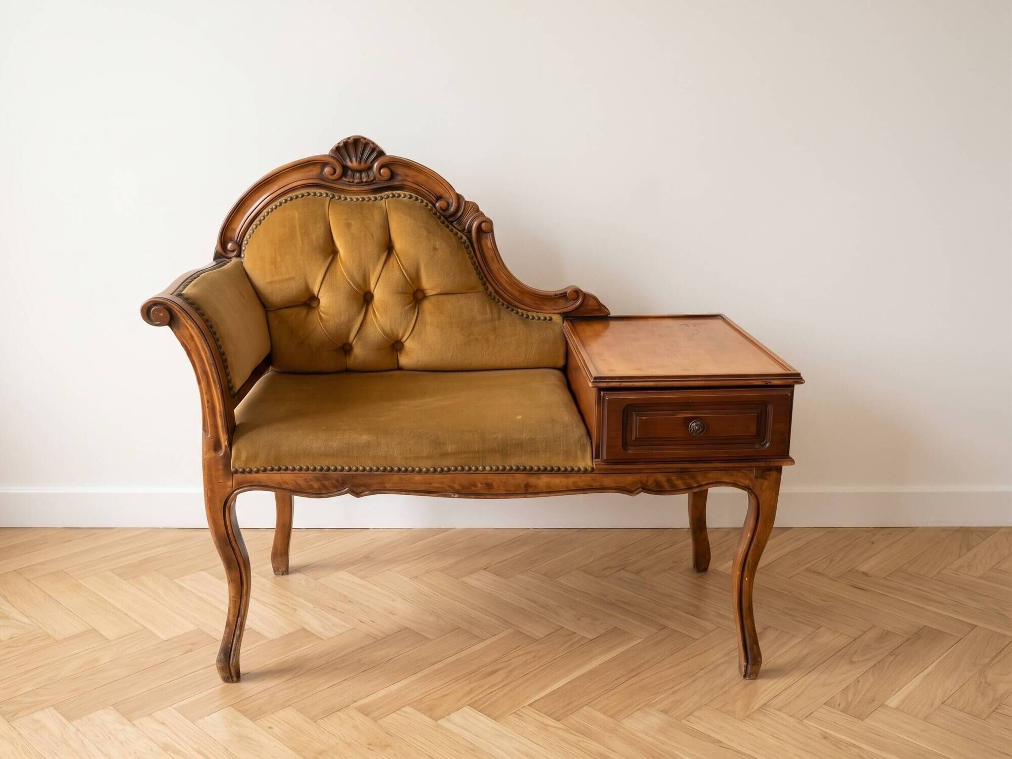 Vintage telephone bench in Louis XV style made of wood and yellow fabric.