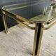 Table basse vintage années 70 en métal doré et verre fumé