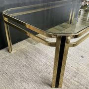Vintage 1970s coffee table in gold metal and smoked glass.