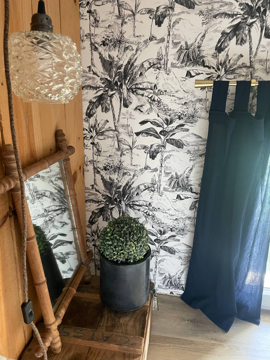 Carved wooden mirror in a bamboo style