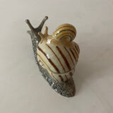 Porcelain figurine snail and its small