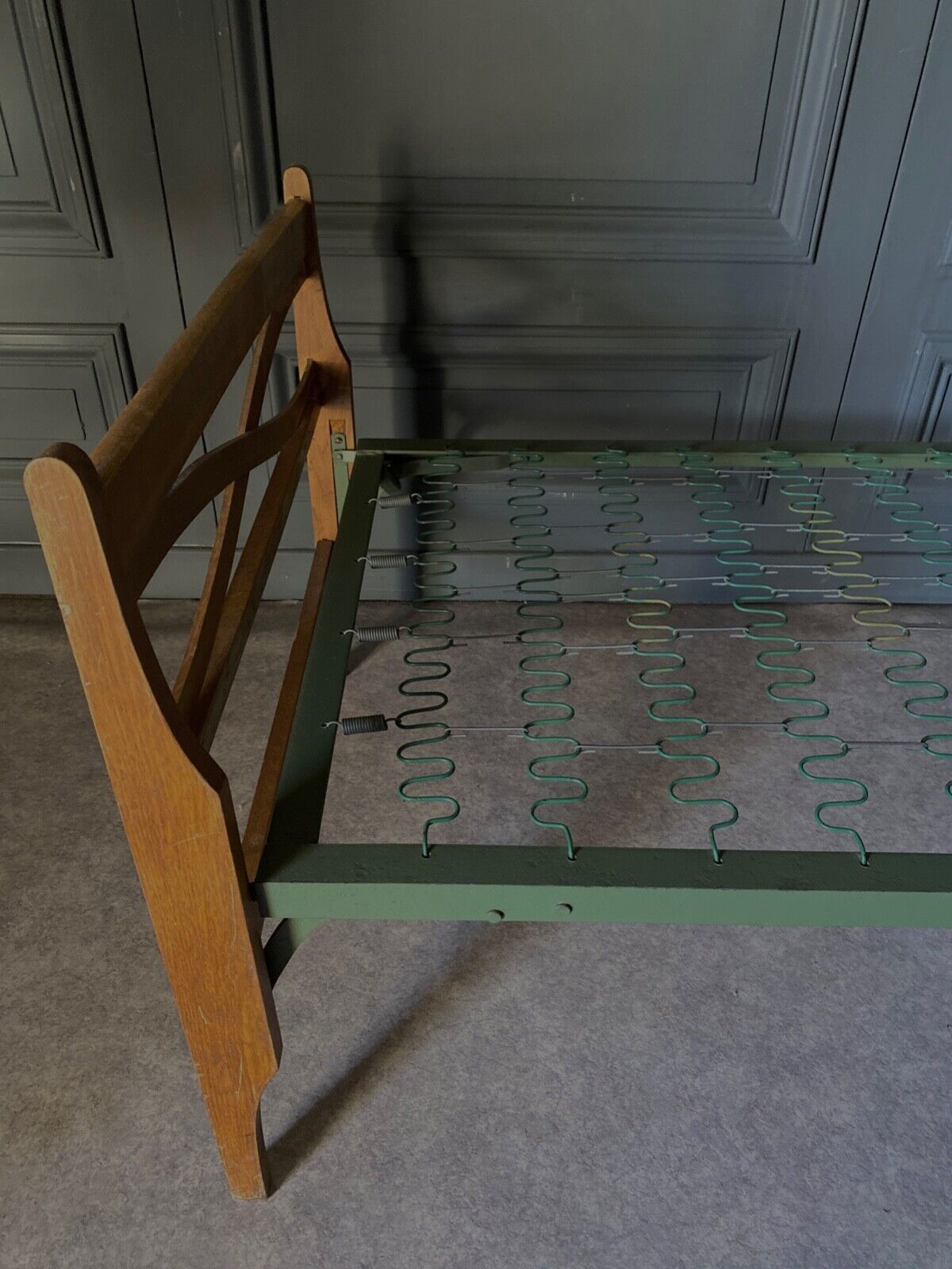 Bed with green metal braces 1960 a person foldable