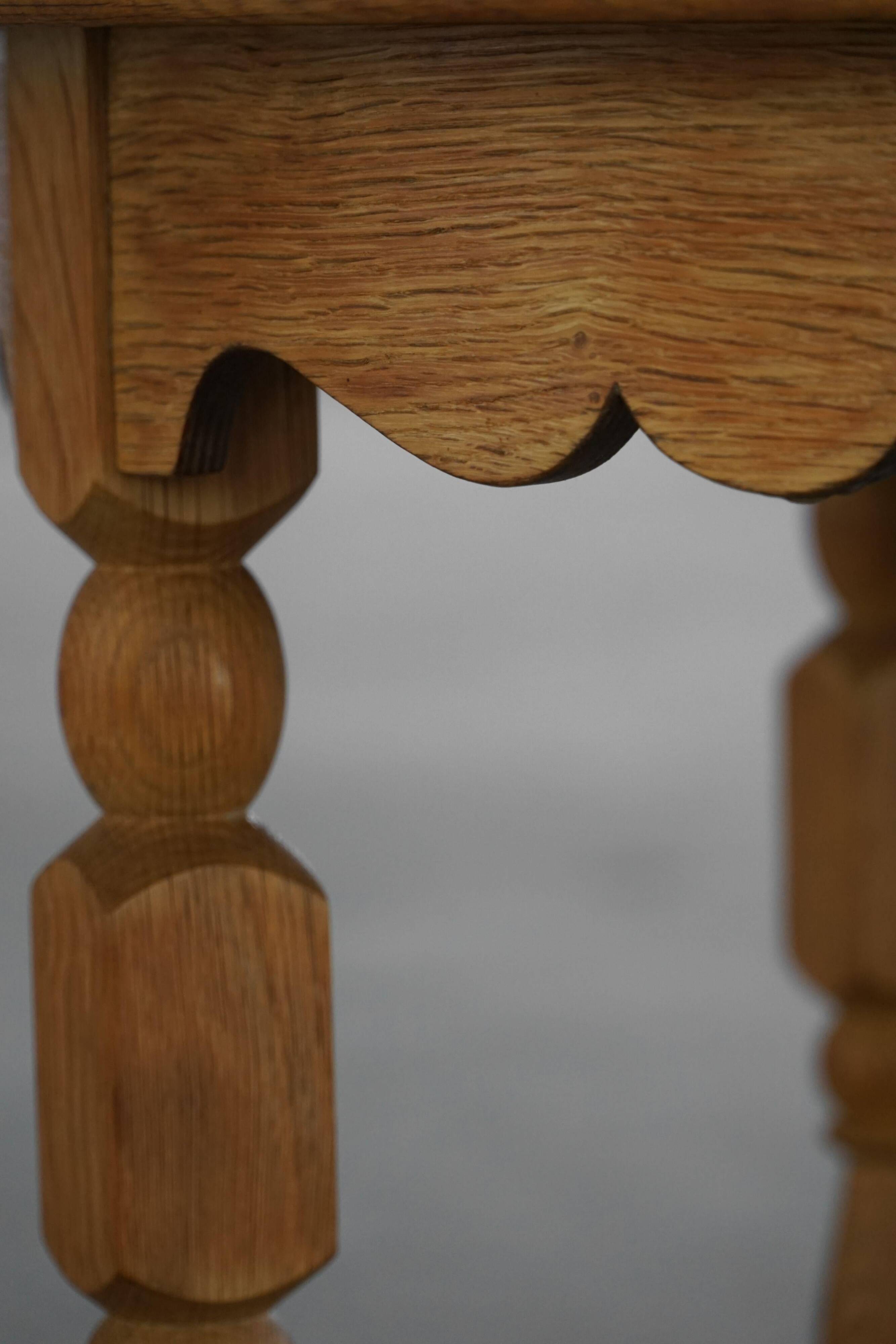 Mid-century Danish round side table in solid oak, Henning Kjærnulf, 1960s.
