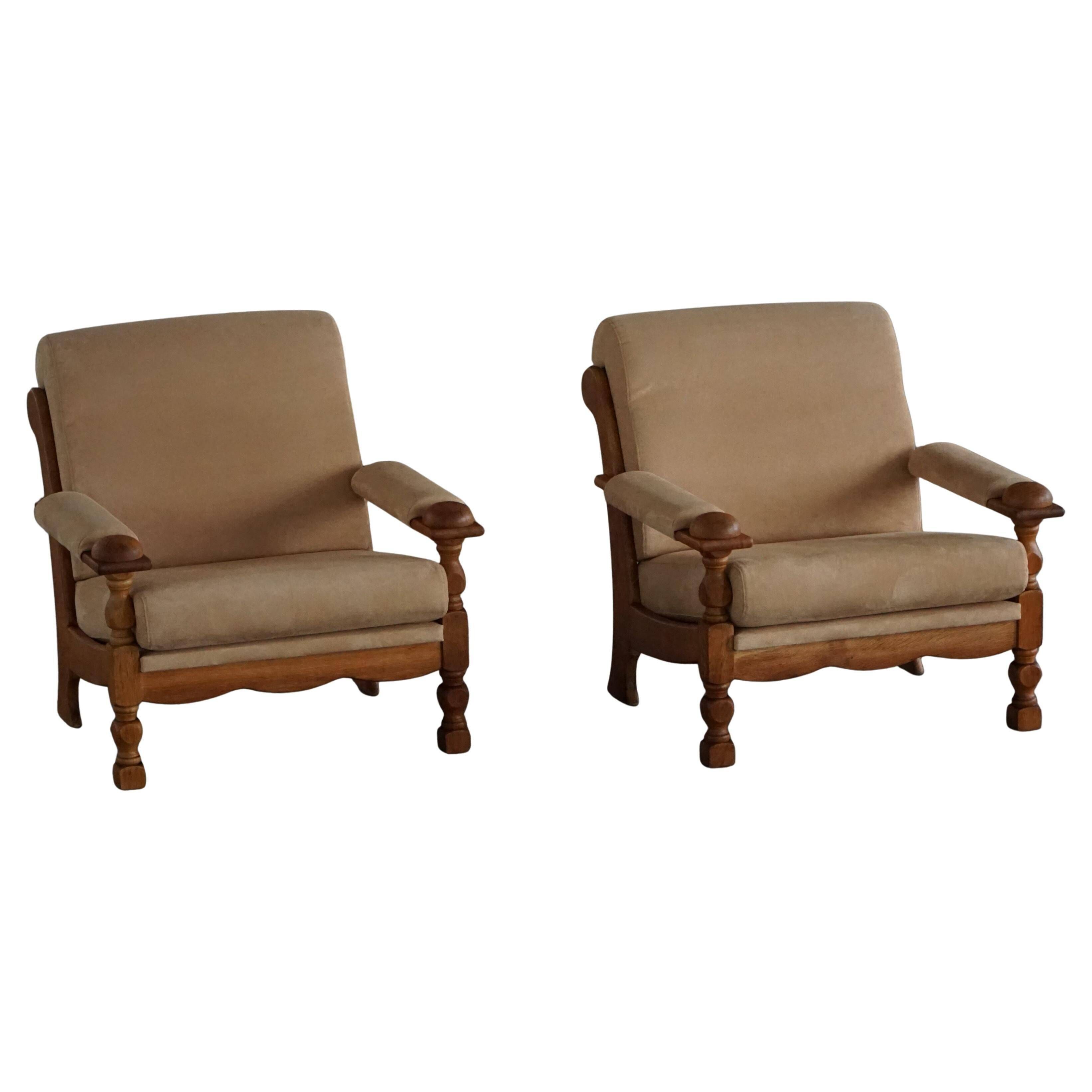 Pair of armchairs by Henning Kjærnulf, Oak Oak and Alcantara, mid-20th century, 1960s.