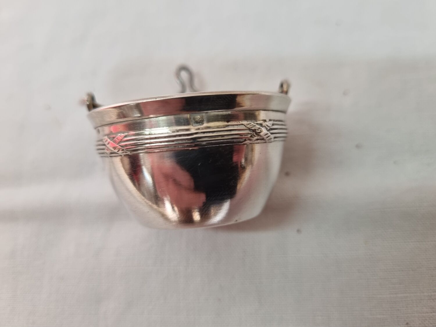Tea strainer, solid silver, neck brace