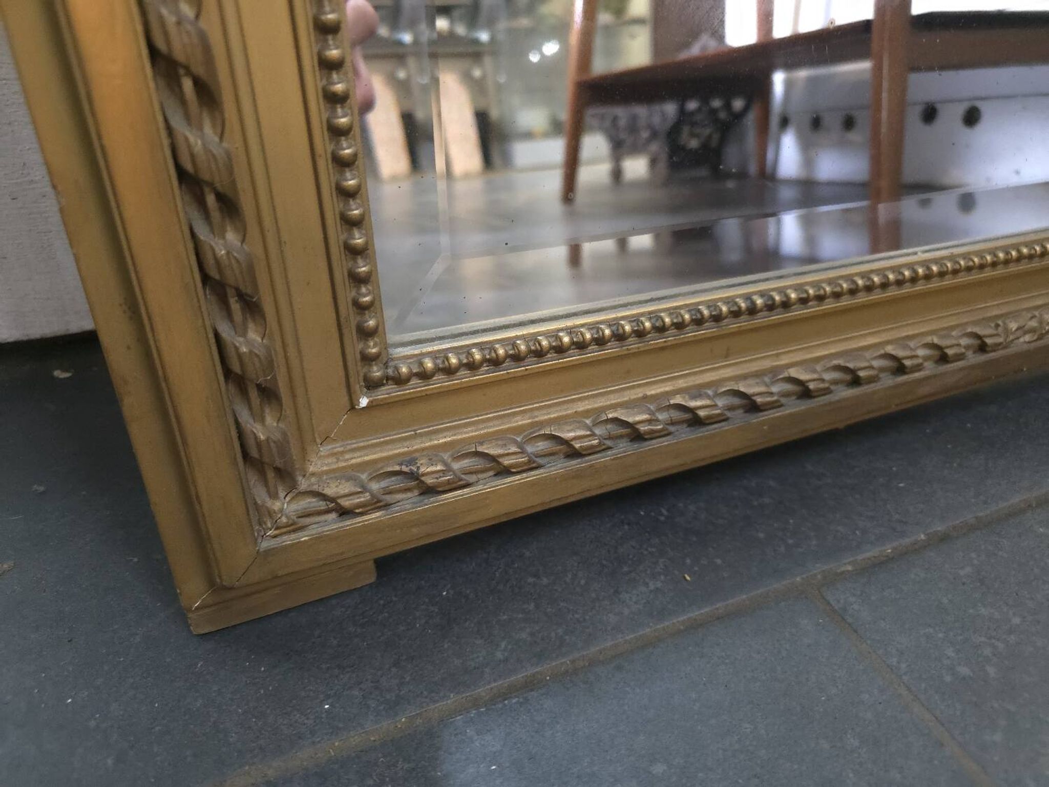Gilded patinated trumeau mirror
