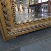 Gilded patinated trumeau mirror