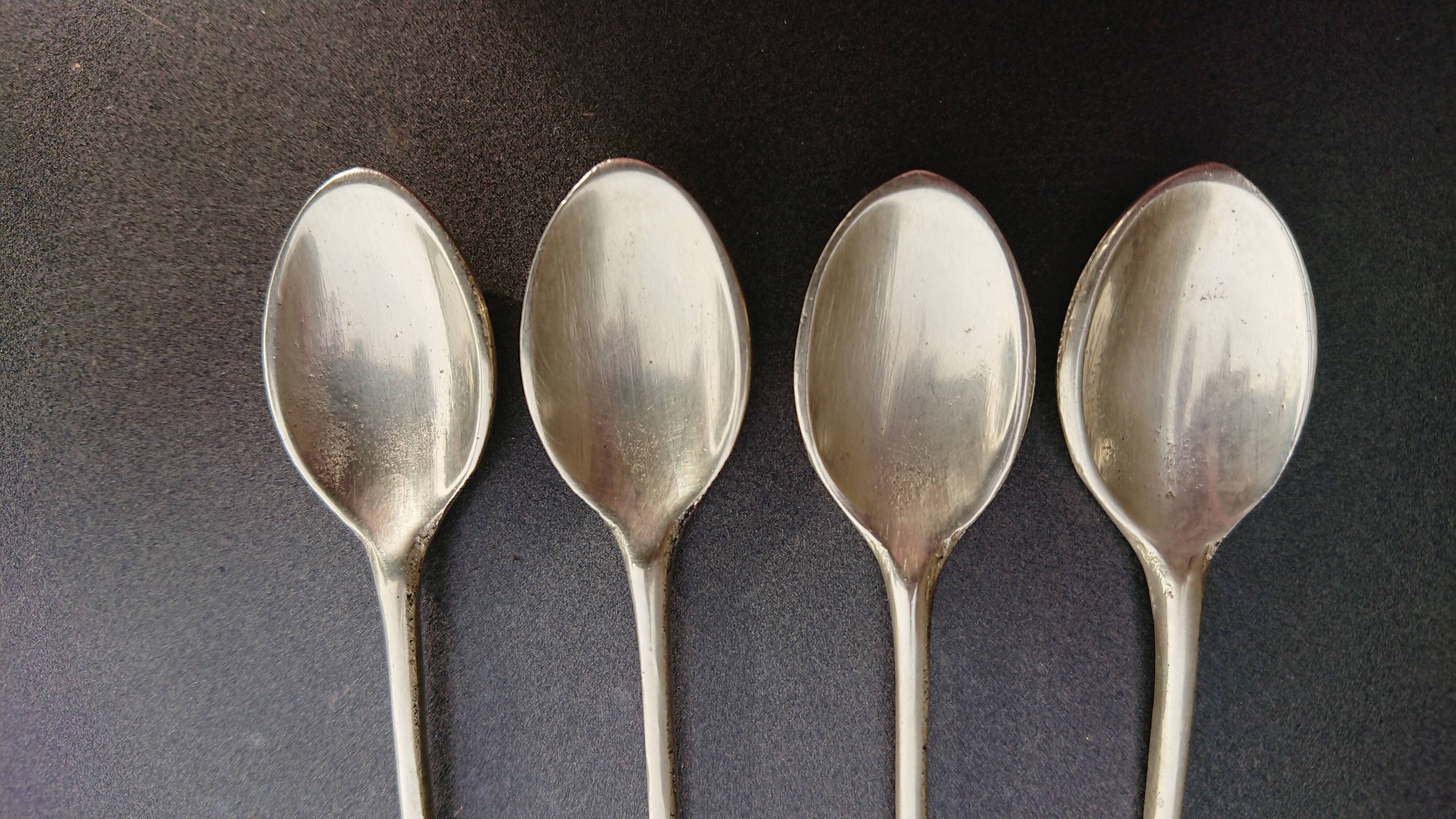 Small golden spoons with punch