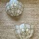 Pair of vintage wall lights in mother-of-pearl and gilded brass.
