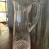 Transparent crystal pitcher, mid-century Hungarian, conical silhouette, sculptural handle and cut decoration.