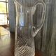 Transparent crystal pitcher, mid-century Hungarian, conical silhouette, sculptural handle and cut decoration.