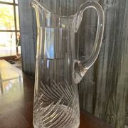 Transparent crystal pitcher, mid-century Hungarian, conical silhouette, sculptural handle and cut decoration.