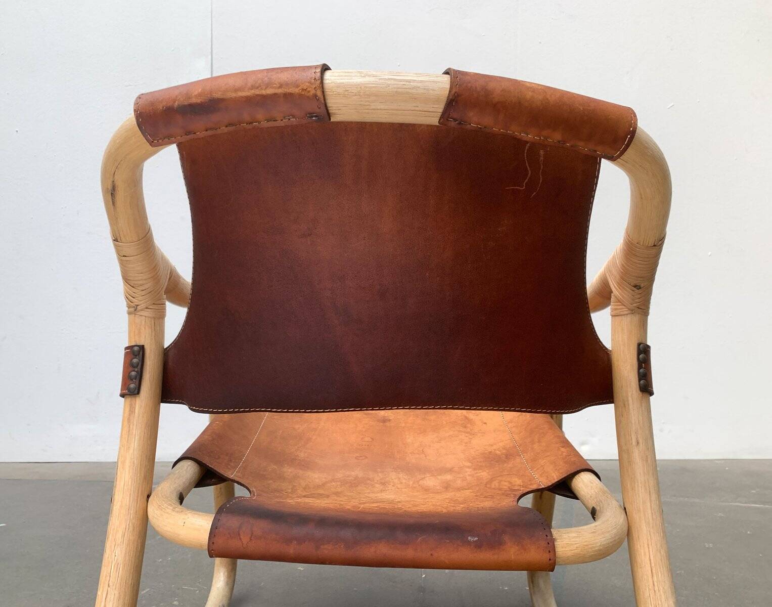 Mid-century safari lounge chair in bamboo and Danish leather, 1960s.