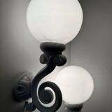 Cast iron and opaline wall lights from the 70s