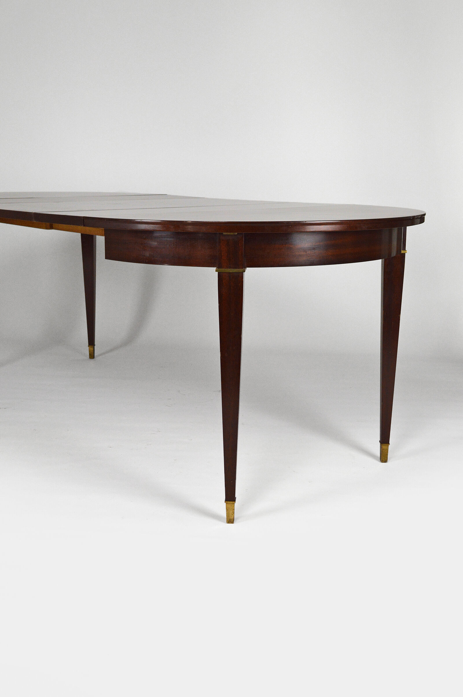 Art Deco mahogany round table by Jacques Adnet around 1940