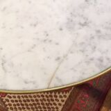 Coffee table with a veined white marble top