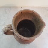 Pitcher in varnished sandstone
