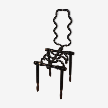 Contemporary "squellette" chair in black lacquered steel