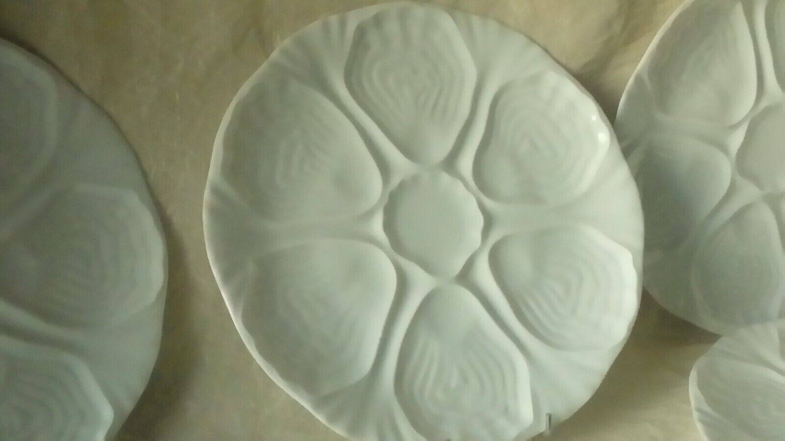 White porcelain oyster plates