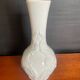 A pair of vintage vases in glazed porcelain.