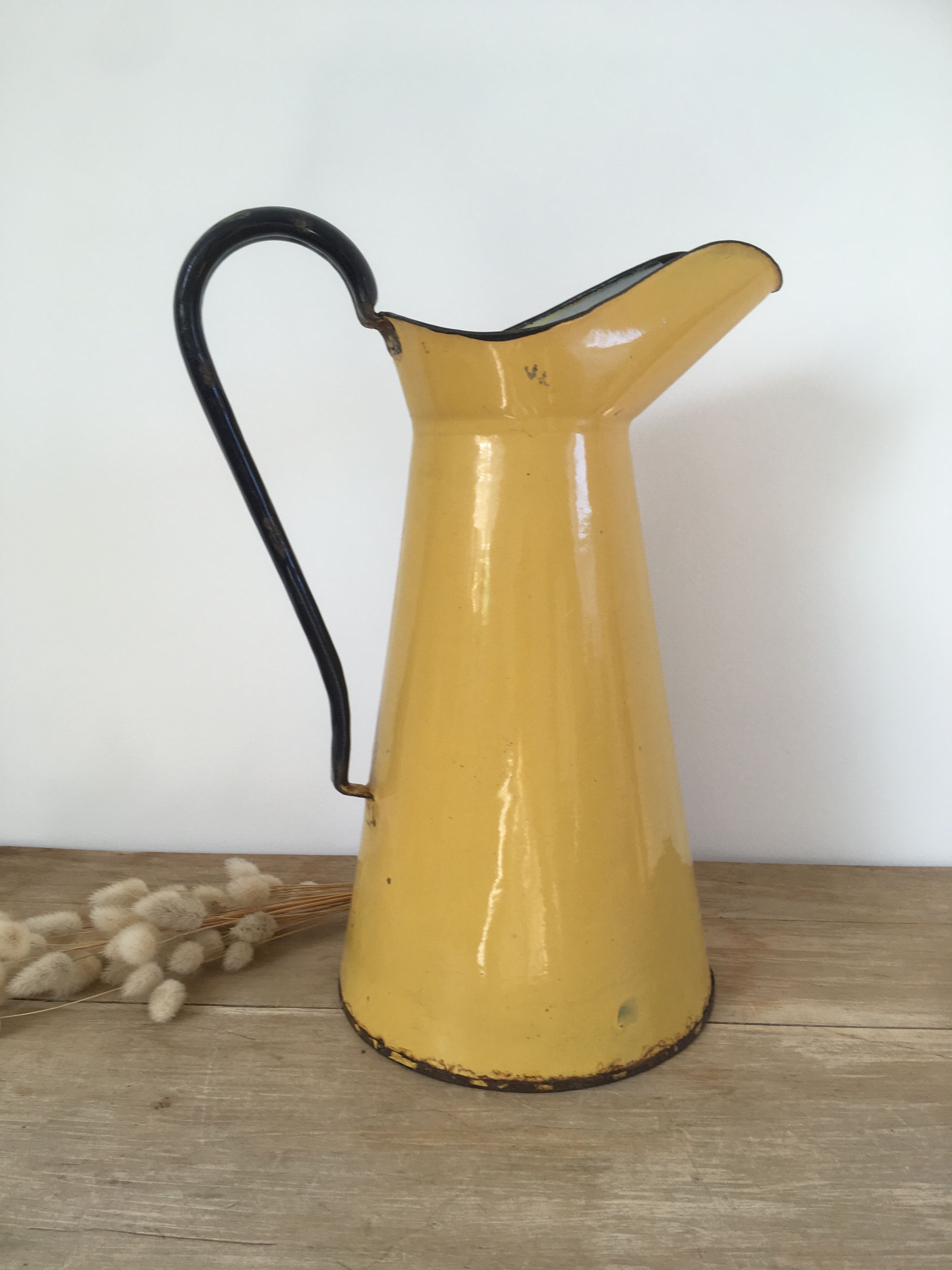 Mustard yellow enamelled sheet metal pitcher