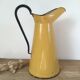 Mustard yellow enamelled sheet metal pitcher