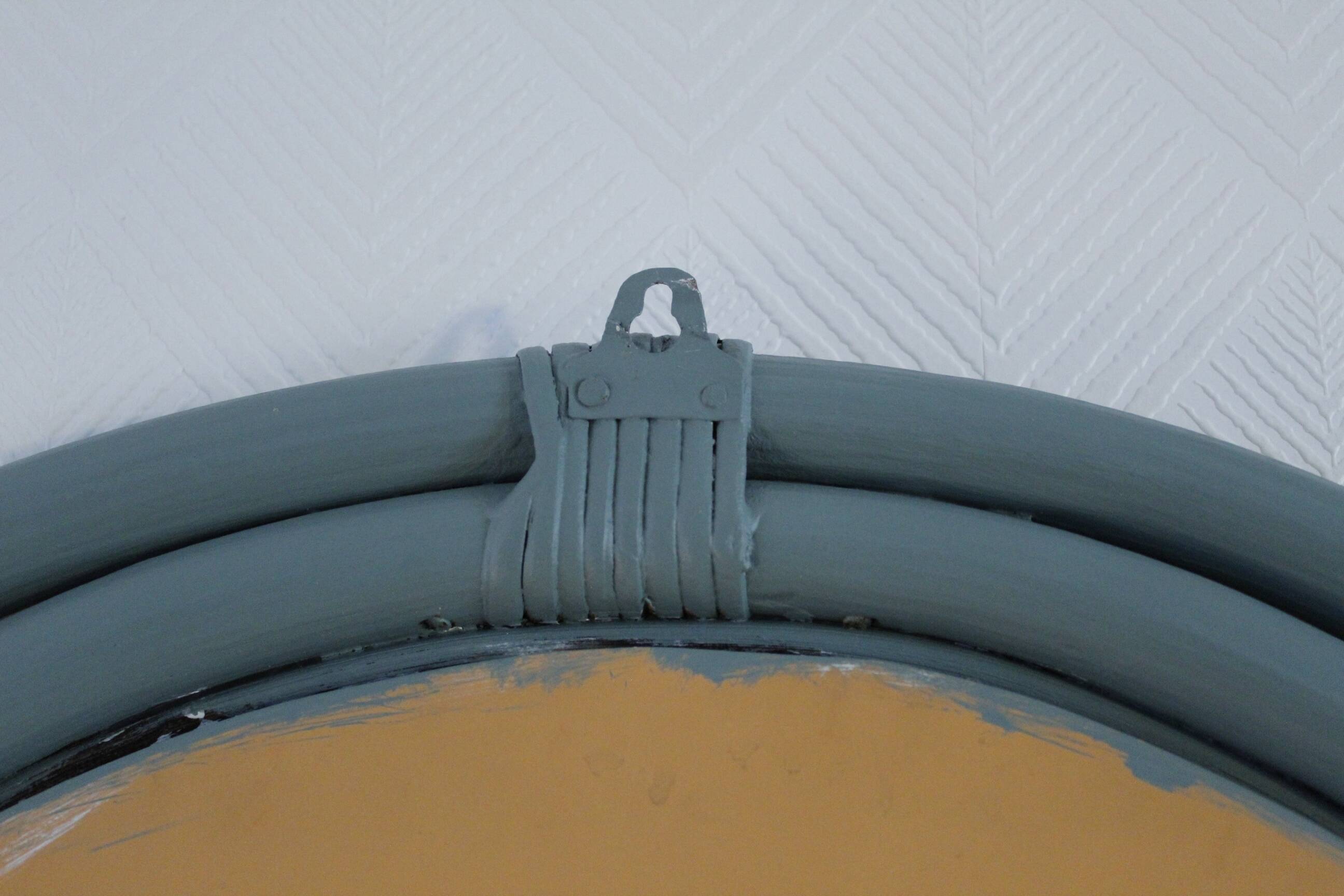 Sage green painted rattan mirror