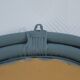 Sage green painted rattan mirror