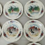 12 plates of the Obernai earthenware décor service signed Henri Loux