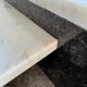 Unique postmodern coffee table in marble and granite.